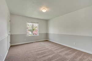 Second bedroom. New carpet and paint throughout home.