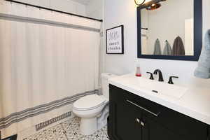 Full bathroom with custom tile.