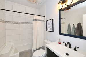 Full bathroom with custom tile.