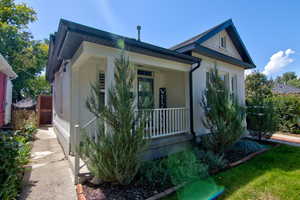 Welcoming front porch with modern front door.