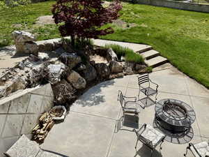 View of patio with a fire pit
