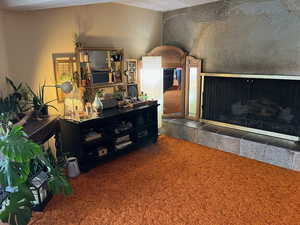 Carpeted living area with a textured ceiling