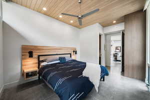 Bedroom with recessed lighting, finished concrete floors, ceiling fan, and wood ceiling