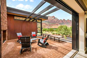 View of patio with a pergola and a mountain view