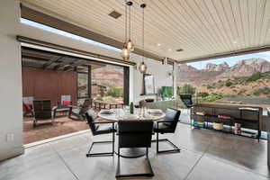 View of patio / terrace featuring a mountain view and outdoor dining area