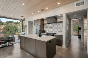 Kitchen with visible vents, stainless steel appliances, a healthy amount of sunlight, and wooden ceiling