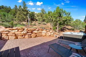 View of patio / terrace with a hot tub