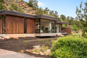 Exterior space with a sunroom