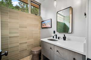Bathroom featuring toilet and vanity