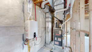 Utility room featuring water heater