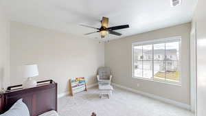 Carpeted bedroom featuring visible vents, ceiling fan, and baseboards