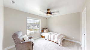 Bedroom featuring visible vents, carpet, and baseboards