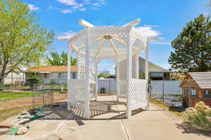 View of patio featuring a gazebo and fence