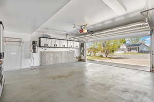 Garage featuring a garage door opener