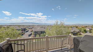 Balcony featuring a mountain view, a residential view, and area for grilling