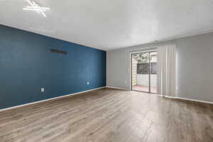 Huge Family Room with Walk-out to Enclosed Patio & Storage Space
