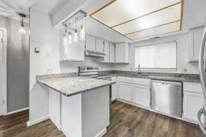 Updated Kitchen with White Cabinets, Stainless Appliances, & Granite Countertops