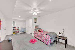 Carpeted bedroom with recessed lighting, visible vents, ceiling fan, and baseboards