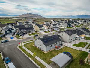 Birds eye view of property with a residential view and a mountain view