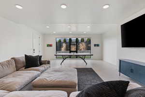 Living room with recessed lighting and wood finished floors