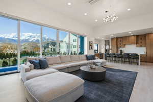 Living area with recessed lighting, light wood finished floors, and a mountain view