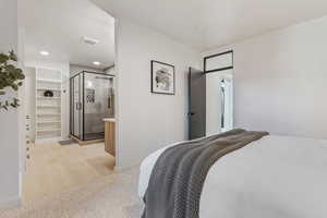 Bedroom featuring visible vents, baseboards, a closet, light wood-type flooring, and a spacious closet