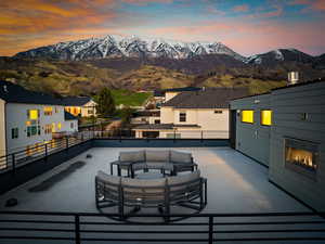 View of patio / terrace featuring a mountain view, an outdoor hangout area, and a balcony
