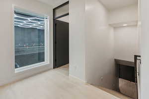 Hallway with wood finished floors
