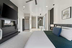Bedroom with recessed lighting, ceiling fan, and ensuite bath