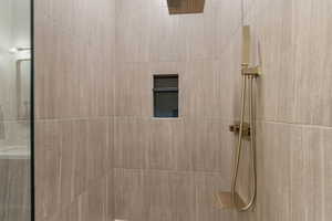 Full bathroom with a tile shower