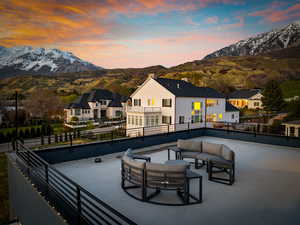 View of patio / terrace featuring a mountain view, an outdoor hangout area, and a balcony