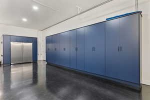Garage with built in fridge and recessed lighting