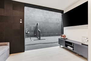 Miscellaneous room featuring wood finished floors