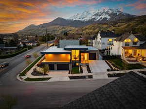View of front of house featuring a mountain view and concrete driveway