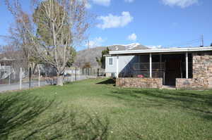 View of backyard and covered deck and patio