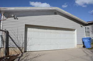 Garage with concrete driveway