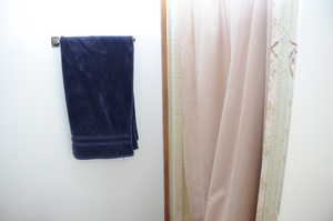 Full bathroom with a shower with shower curtain