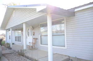 View of home's exterior featuring covered porch