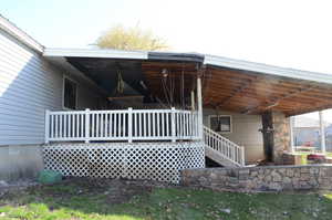 View of covered deck and covered Patio with fireplace
