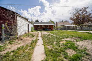 View of yard featuring fence