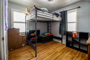Bedroom with wood finished floors