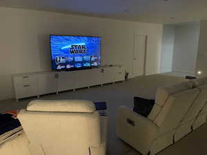 Carpeted living room with baseboards