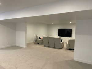 Interior space with recessed lighting, light carpet, and baseboards