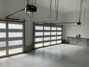 Garage featuring a garage door opener