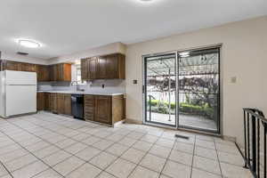 Large Kitchen Dining Area with Doors to Covered Back Patio