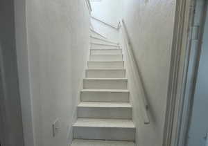 Staircase with a textured wall