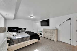 Bedroom featuring visible vents and light carpet