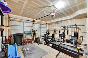 Exercise room with a garage