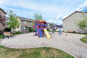 Community jungle gym featuring a residential view
