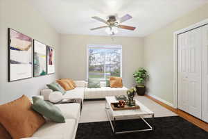 Large primary bedroom virtually staged with sitting area